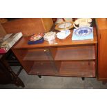 A teak cabinet with glass sliding doors