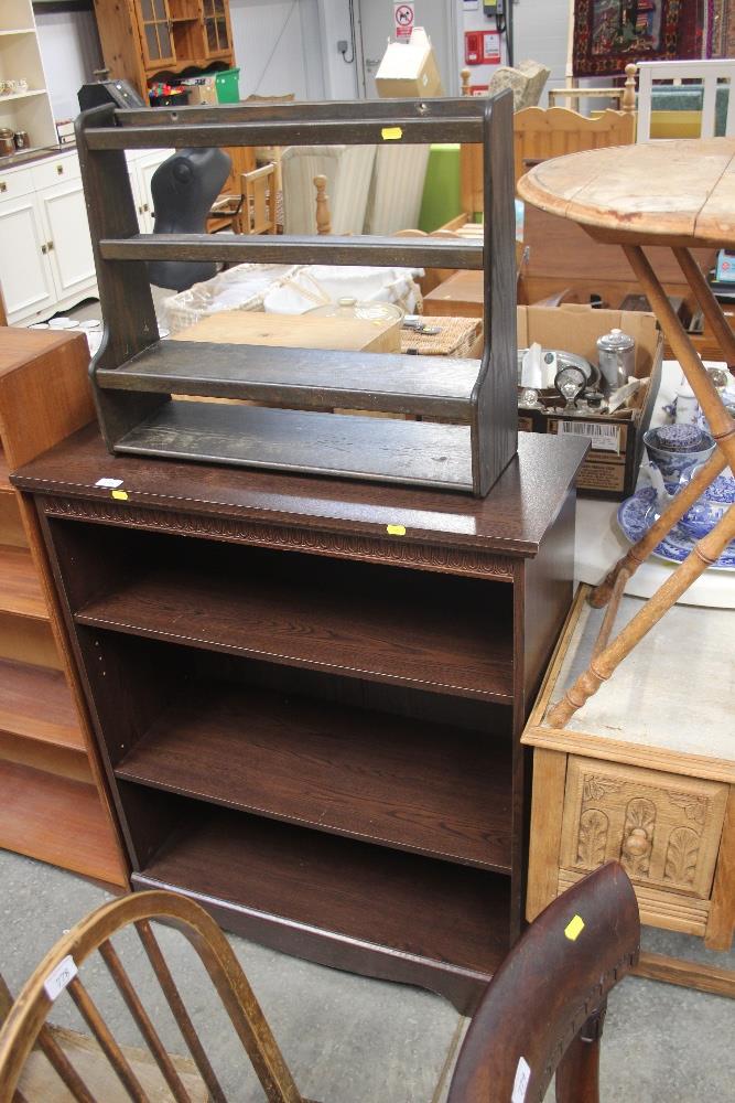 An oak effect open fronted bookcase