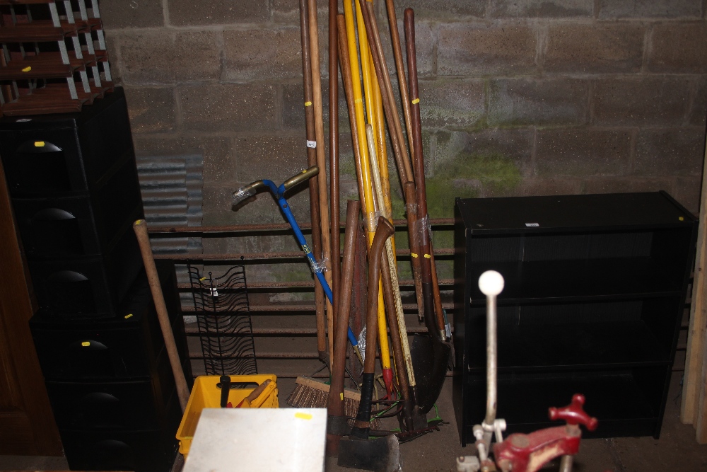 A quantity of long handled gardening tools