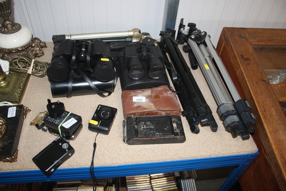 A quantity of various cameras and binoculars