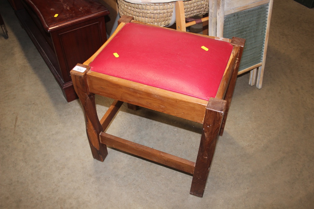 A leather upholstered stool