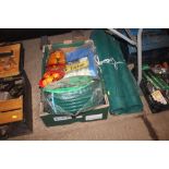 A box containing as new tarpaulins, tow rope and h