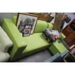 A green leather upholstered corner suite