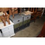 A pair of painted pine three drawer bedside chests