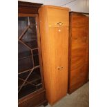 A teak effect narrow cupboard