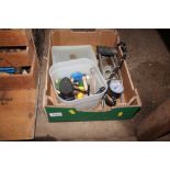 A box containing a foot pump and various fishing g