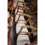 A set of four walnut bar back dining chairs