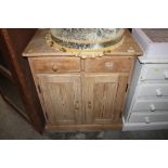 A stripped pine cupboard, fitted two drawers, (lac