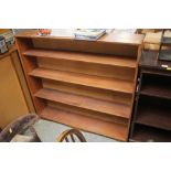 A teak open fronted bookcase