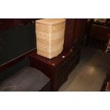 A laundry basket together with a bedside chest, fi