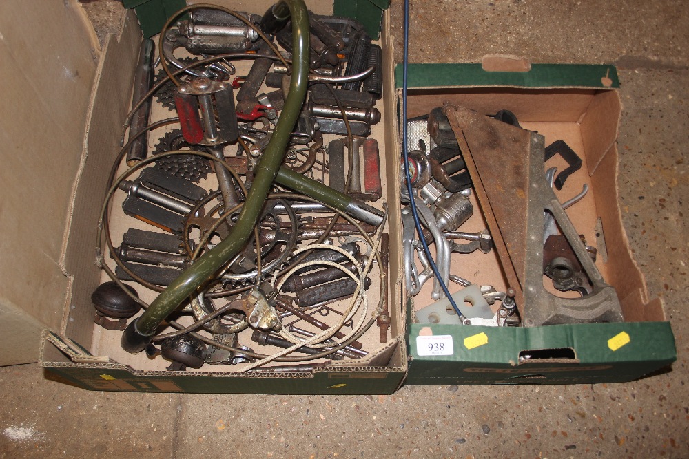 Two boxes of spare bicycle parts