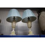 A pair of marble effect table lamps and shades