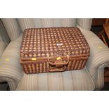 A wicker picnic hamper and contents