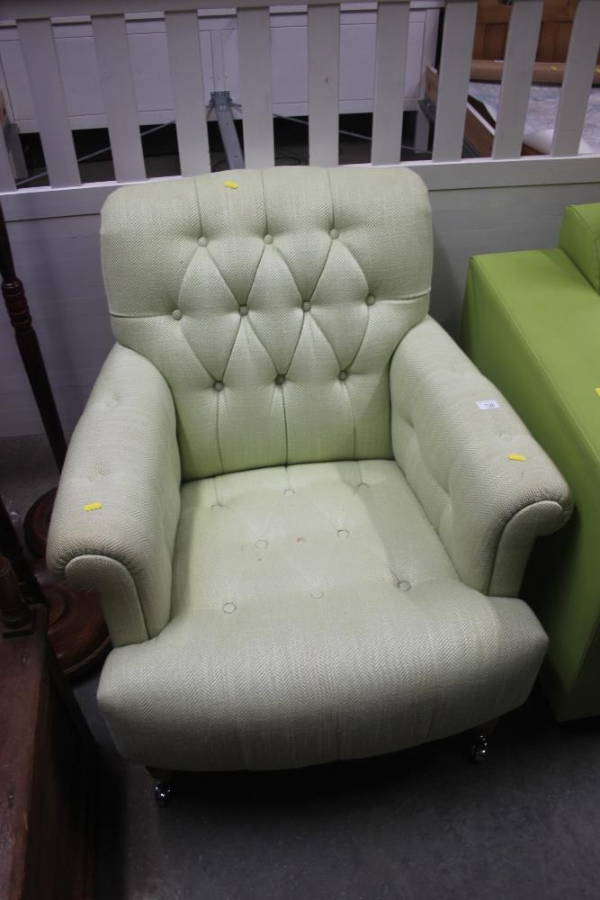 A buttoned down upholstered Laura Ashley armchair