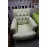 A buttoned down upholstered Laura Ashley armchair