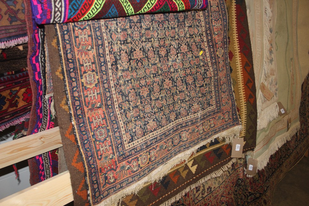 An approx. 5ft 6ins x 3ft Eastern pattern rug