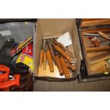 A box of woodworking chisels etc.