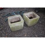 A pair of concrete planters