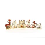 A Victorian Staffordshire flatback clock tower spill holder; another in the form of a castle and