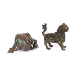 A 19th Century tinned copper mosque lamp; and a bronze figure of a cat, the body decorated with
