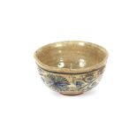 An Antique Chinese glazed earthenware bowl, having foliate decoration, 11.5cm dia.
