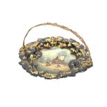 A Victorian papier mache cake basket, with gilt metal handle, decorated with a painted scene