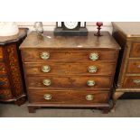 A George III mahogany and chequer banded chest, fitted four long graduated drawers, raised on