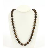 An amber and ebony necklace