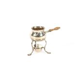 A small silver brandy saucepan on spirit heater stand, London 1910