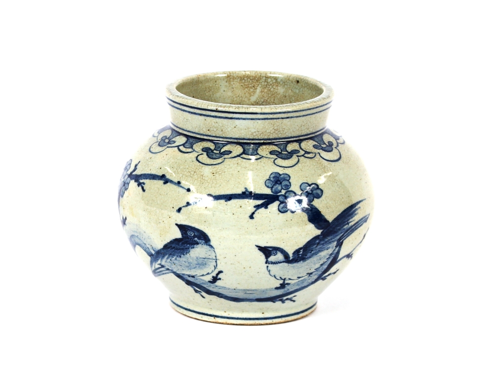 A 20th Century Korean blue and white porcelain baluster jar, decorated with birds and foliage,