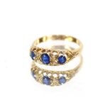 A three stone sapphire and diamond 18 carat gold ring, size 0