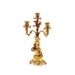 A 19th Century gilt bronze three branch candelabrum, with cherub and foliate decoration, 40cm high