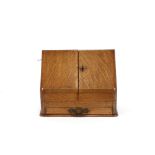 A Victorian golden oak stationery cabinet, with a sloping front, 32cm wide