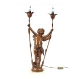 A bronzed cherub table lamp, raised on a marble plinth, 72cm high