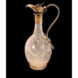 A cut glass and white metal mounted baluster claret jug, having entwined rope twist handle, the body