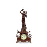 A decorative marble and spelter mantel clock, in the Art Nouveau style, having figural and floral