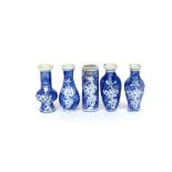 A collection of five Chinese porcelain miniature vases, decorated in under-glazed blue with prunus