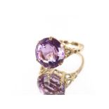 A large amethyst 9 carat gold mounted ring