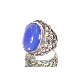 A "Fern" stone silver mounted ring; and a large blue stone mounted ring, (2)