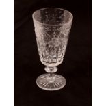 Twelve hob-nail and star cut wine glasses; and a set of four Tudor etched and cut foliate pattern