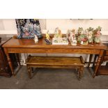 A 19th Century style oak serving table, raised on turned tapering supports, 197cm wide