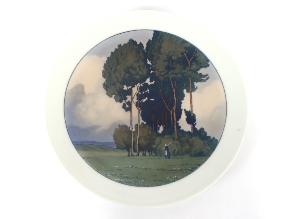 A Meissen Art Deco wall plate, finely painted under glaze landscape with figure, cross swords