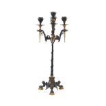 A 19th Century classical bronze and gilt decorated three branch candelabrum, raised on three claw