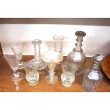 A pair of cut and etched glass thistle shaped beakers; two Victorian decanters; a cut glass
