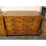 A 19th Century continental walnut chest, of four long drawers, flanked by ebonised pillars and