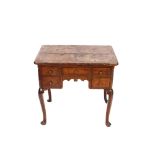 An 18th Century Pollard oak and walnut low boy, the shaped top above five frieze drawers, raised