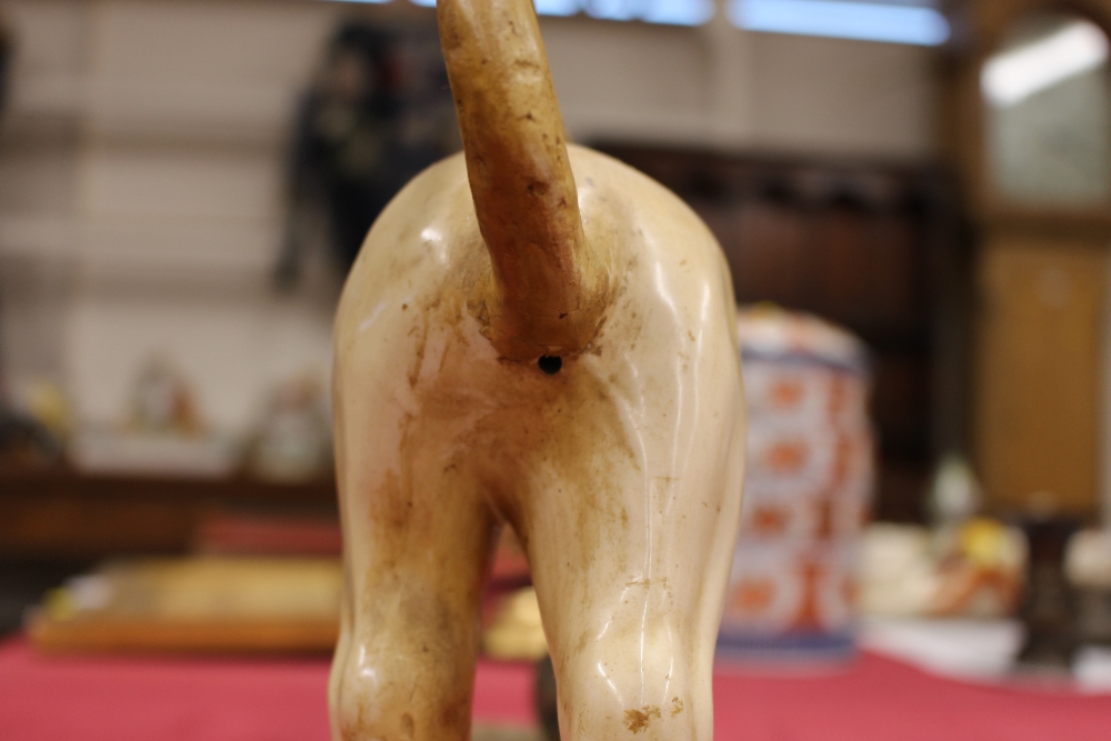 A 19th Century Staffordshire lion figure, right paw resting on a ball, 34cm long - Image 4 of 14