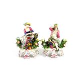 A pair of Chelsea figurines, having raised anchor mark, depicting seated flower sellers on