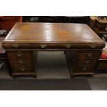 A walnut knee-hole pedestal writing desk, leather inset top fitted three frieze drawers with three