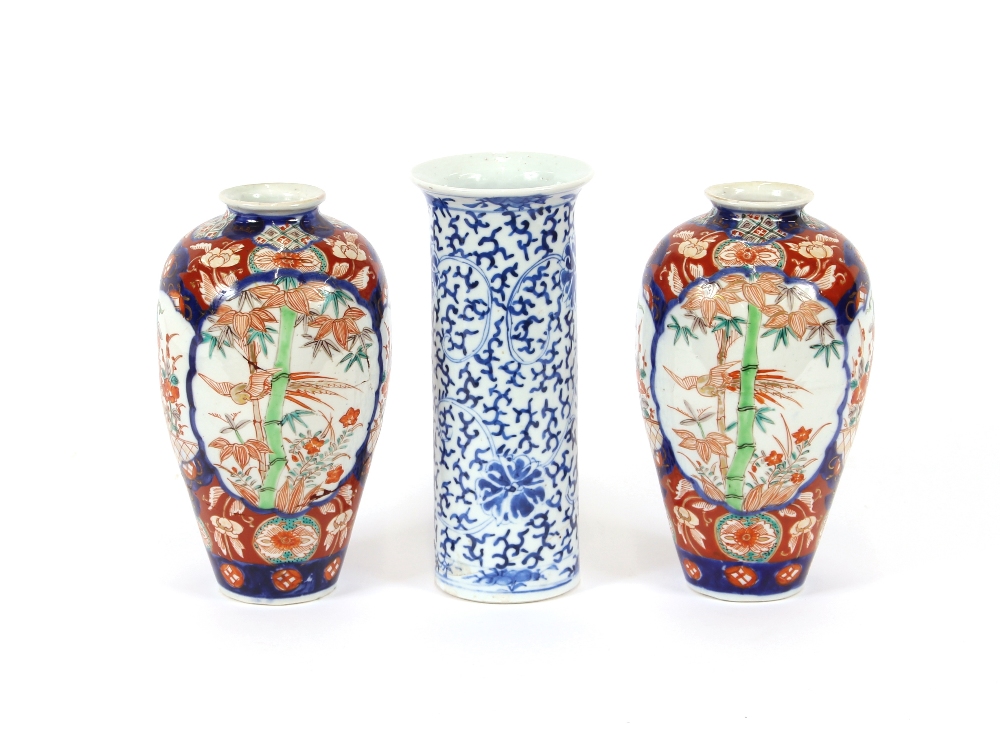 A near pair of Japanese Imari vases, 20cm high; and a Chinese porcelain cylindrical vase with